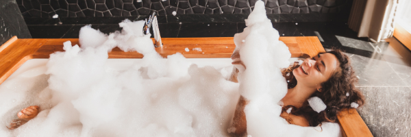 woman in wooden bubble bath