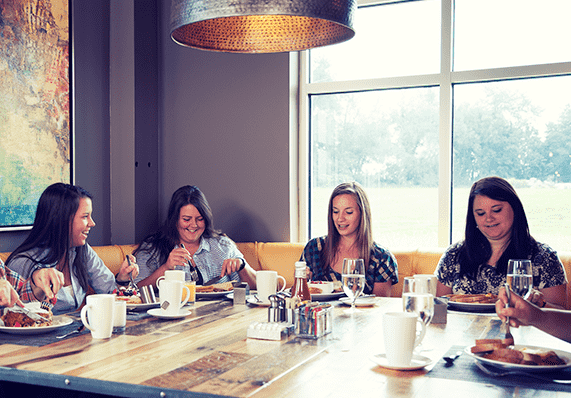 group of women eating breakfast at Forklift & Palate restaurant