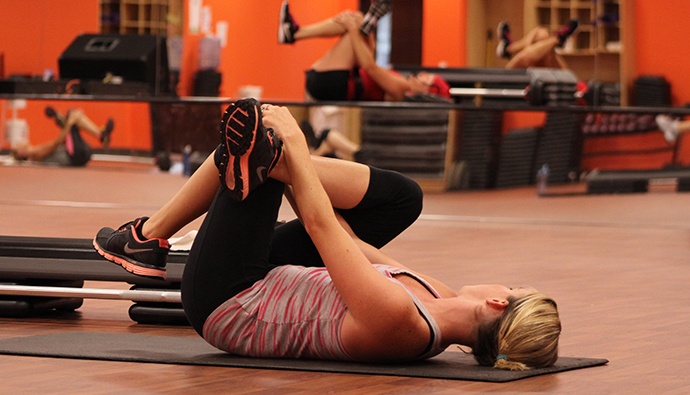 woman stretching on yoga mat at Warehouse Hotel in Manheim, PA
