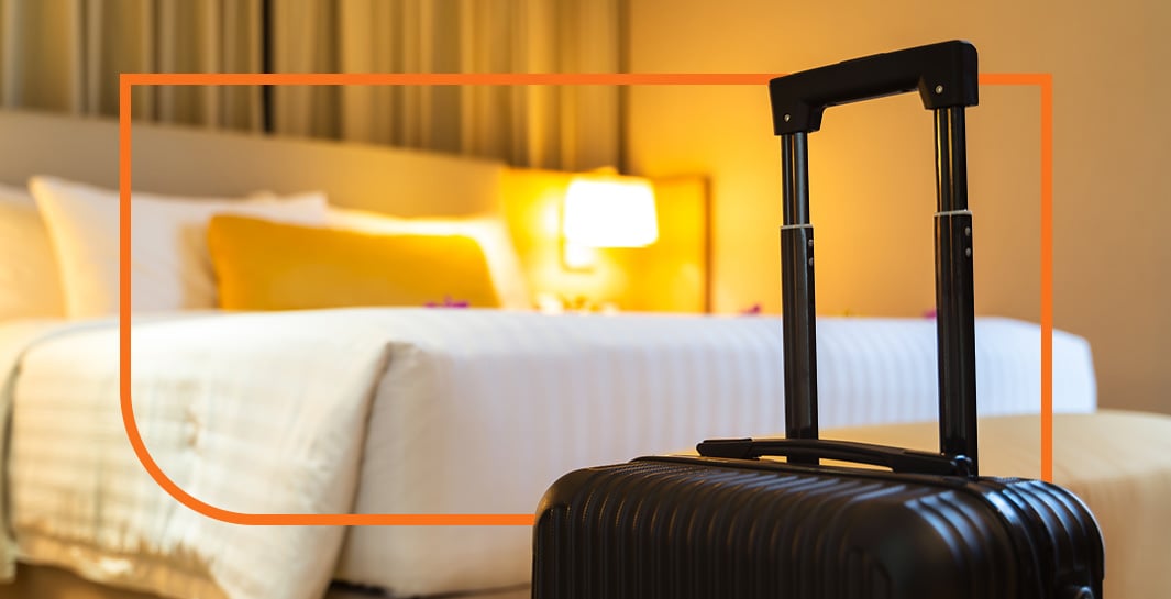 suitcase and bed at Warehouse Hotel in Manheim, PA
